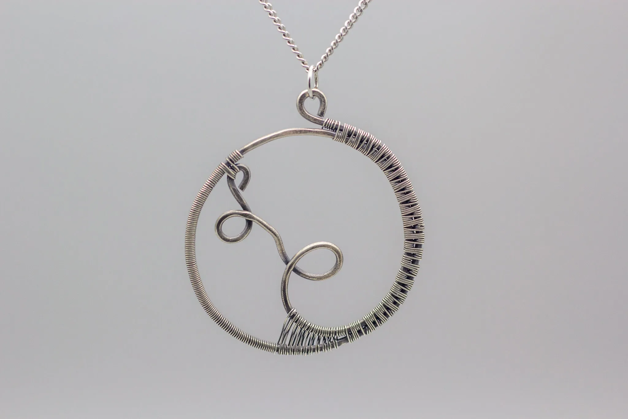Circular Sterling Silver Wire Wrapped Pendant