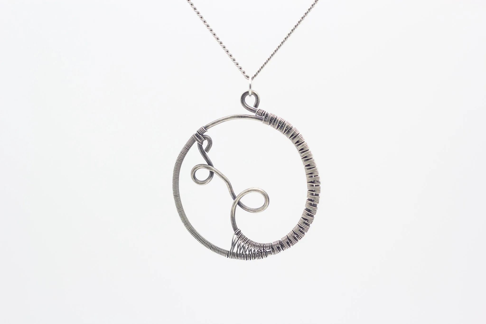 Circular Sterling Silver Wire Wrapped Pendant