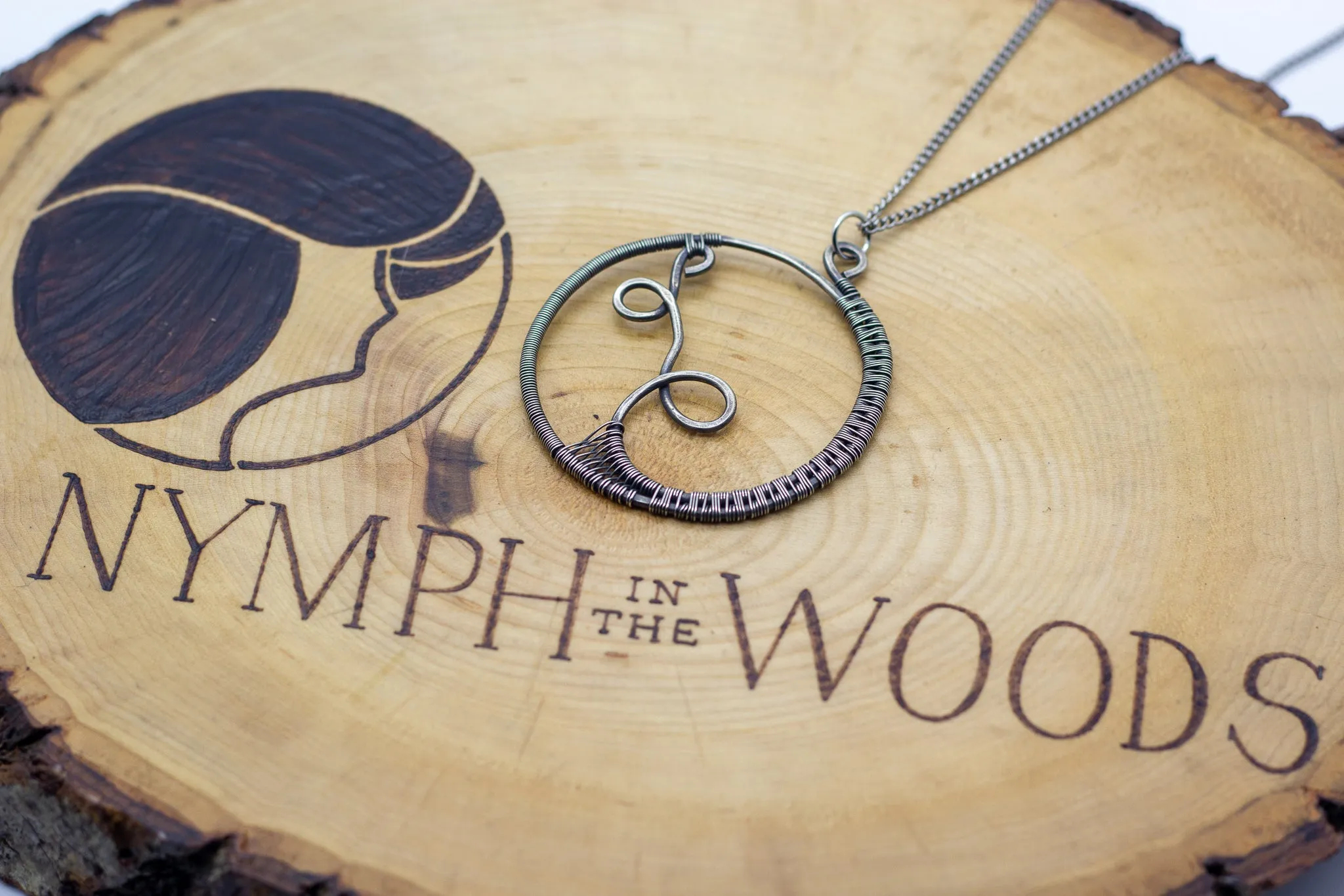 Circular Sterling Silver Wire Wrapped Pendant