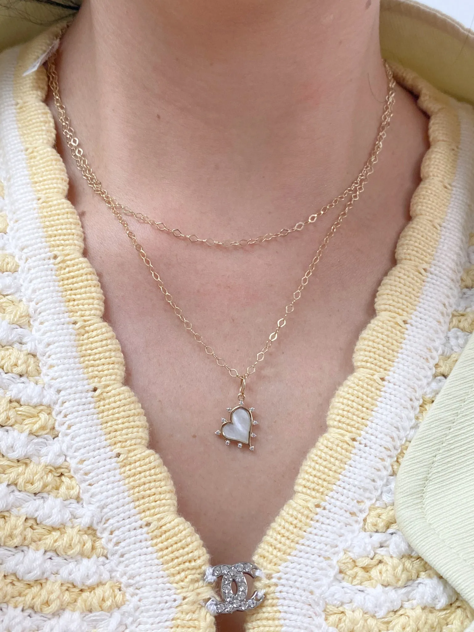 Sideways Mother of Pearl Heart with Halo Cubic Zirconia Pendant