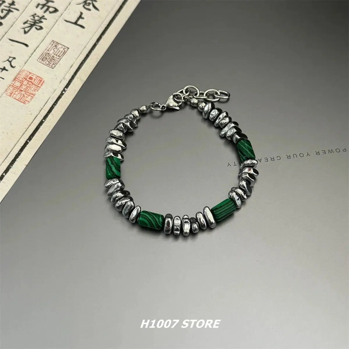 Silver Beaded Bracelet with Green Accents
