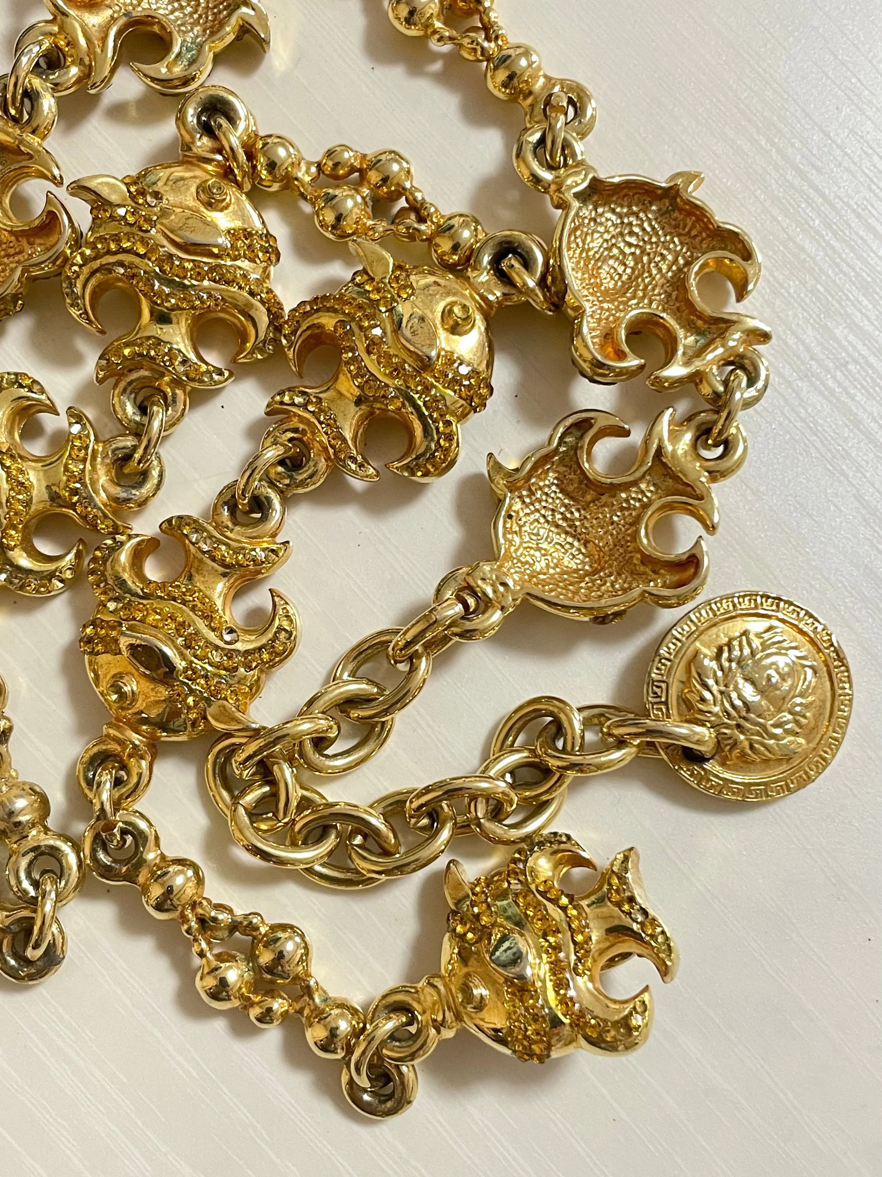 Vintage Gianni Versace golden chain necklace with fish and Medusa charms and yellow crystals. Can be a belt as well. 050719ya1